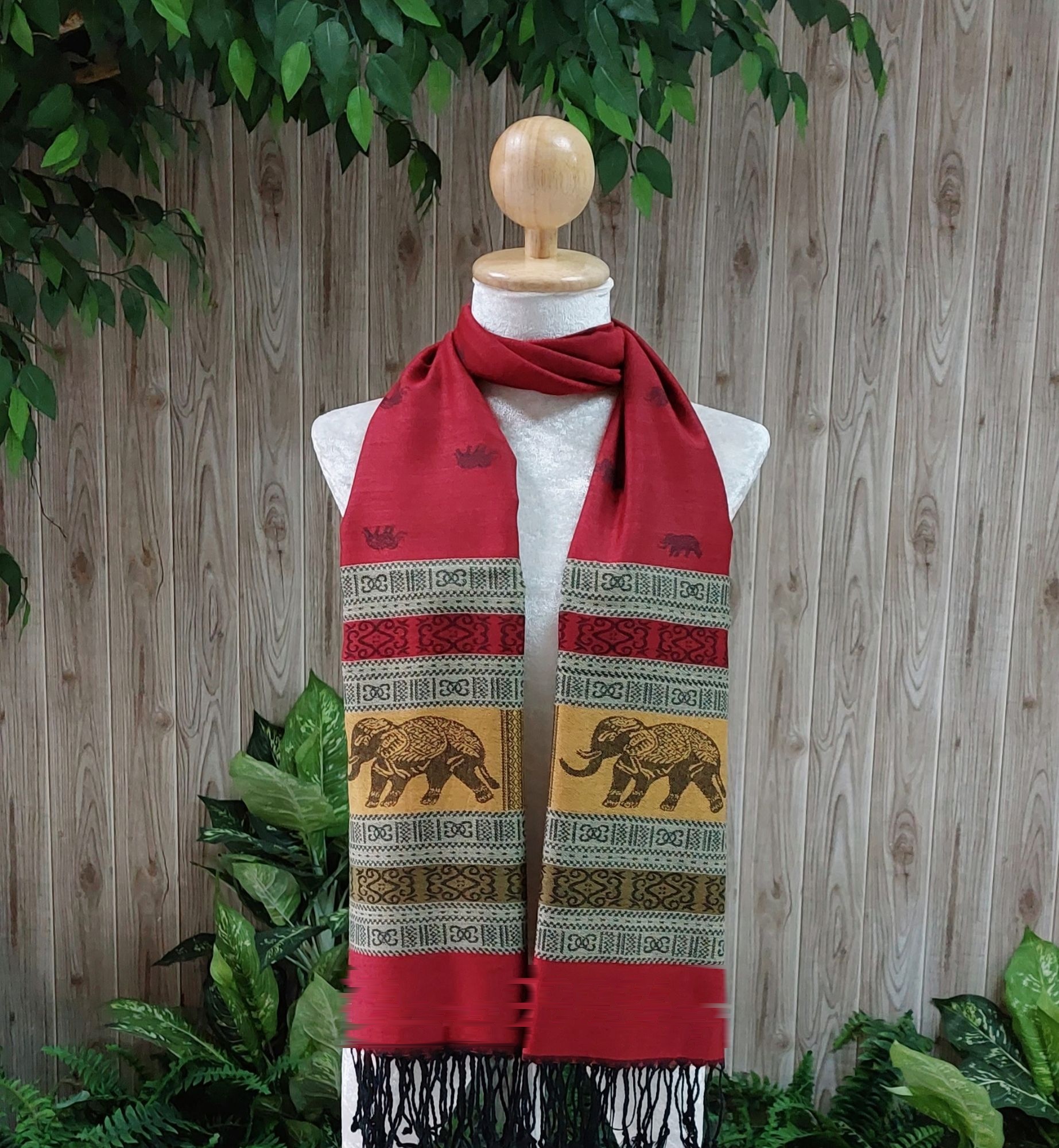 Elephant silk shawl in crimson red on a mannequin