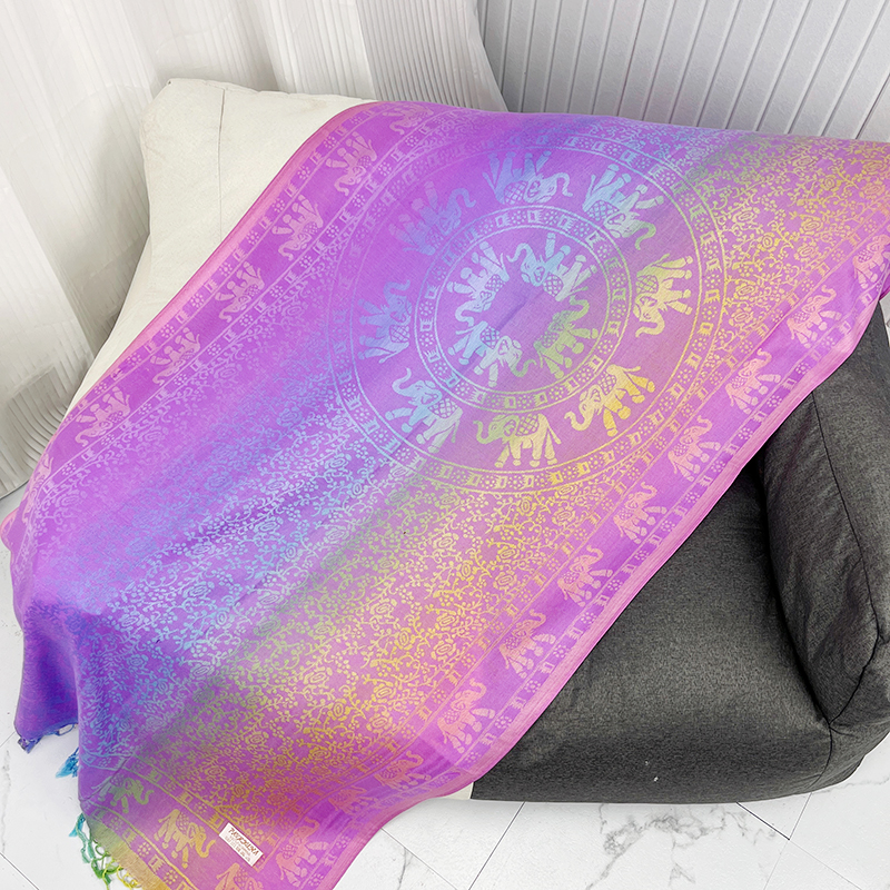 Rainbow ombré elephant scarf in purple and gold, laid flat
