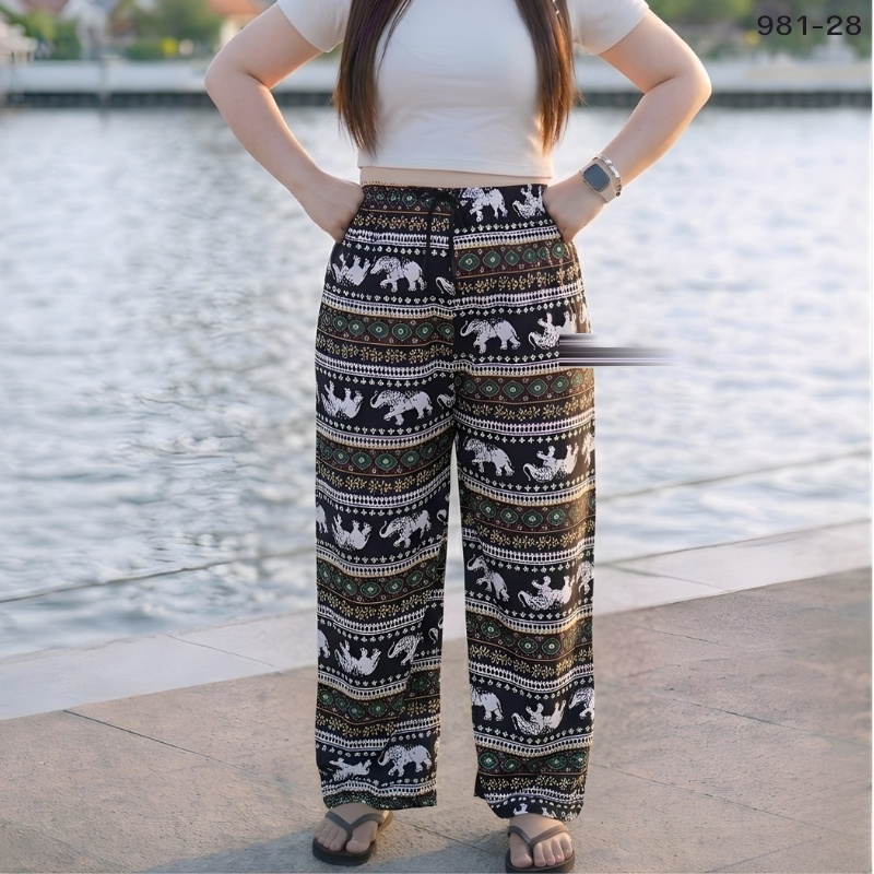 Elephant print trousers in olive, gold and black