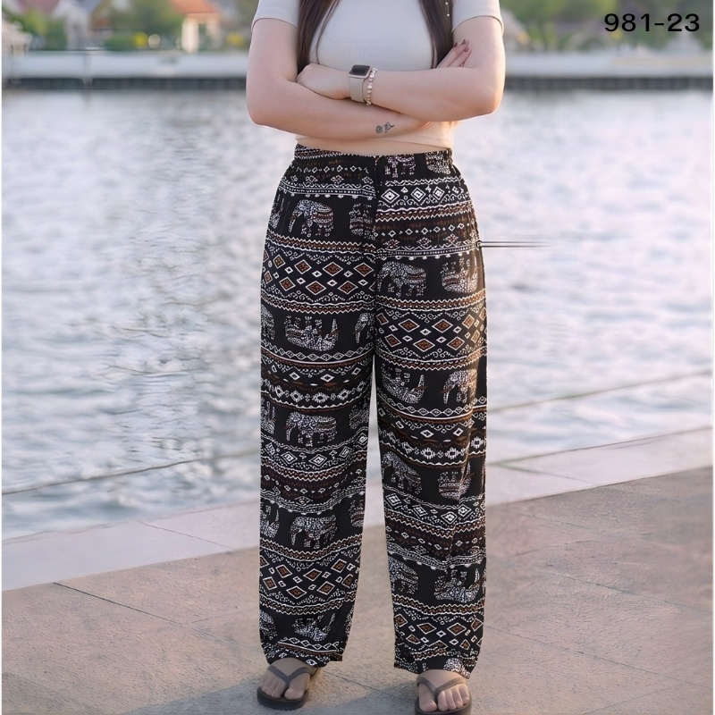 Elephant print trousers in rust and cream