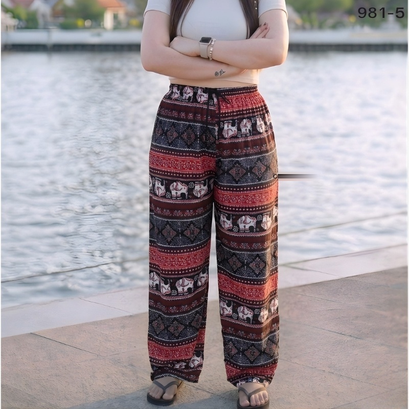 Elephant print trousers in brick red and black